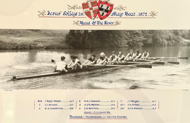 Black and white photo of the crew on the river, bordered and crested with crew member names. The title reads "College 1st May Boat, 1972. Head of the River"