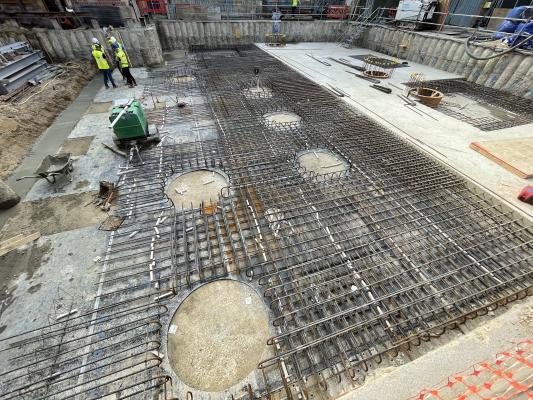 Steel supports are laid at ground level and then cast in concrete