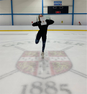 Katy celebrating finishing her project on an ice rink