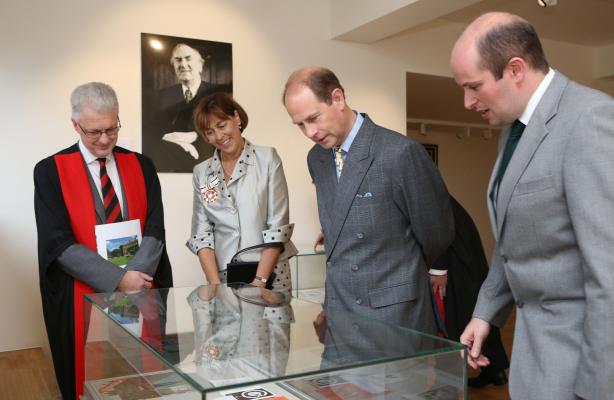 HRH The Earl of Wessex and others looking into a display case