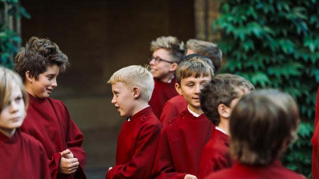 Image of choristers in cloisters