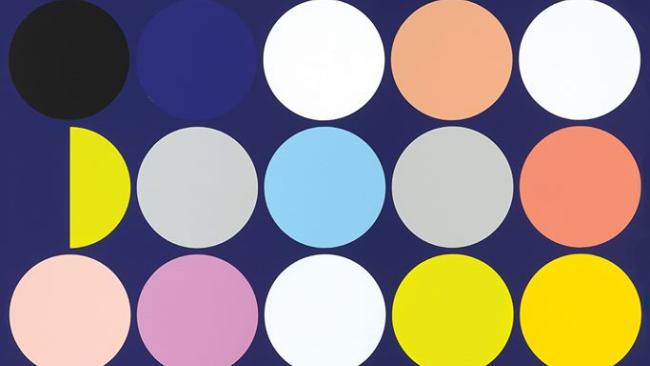 Image of Rows of circles of different colours on a blue background