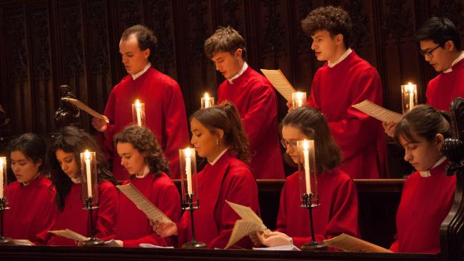 Choir singing in inner chapel stalls
