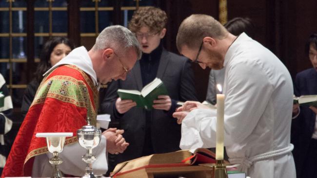 Image of Chaplains bowing at Communion