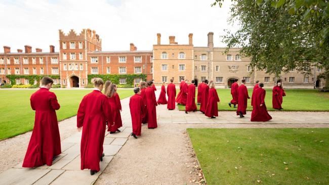 Image of Jesus College choir, walking outside