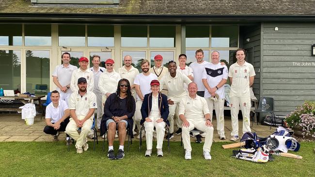 Image of The Master, staff, and Fellows dressed in cricket whites