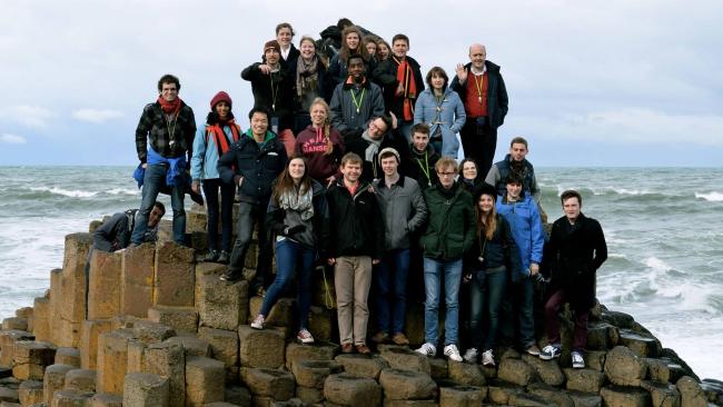 Image of Choir posing for a group photo at Giant's Causeway