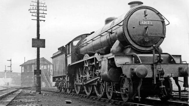 Image of A steam train on railway tracks