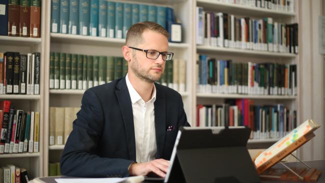 Image of Person studying in a library