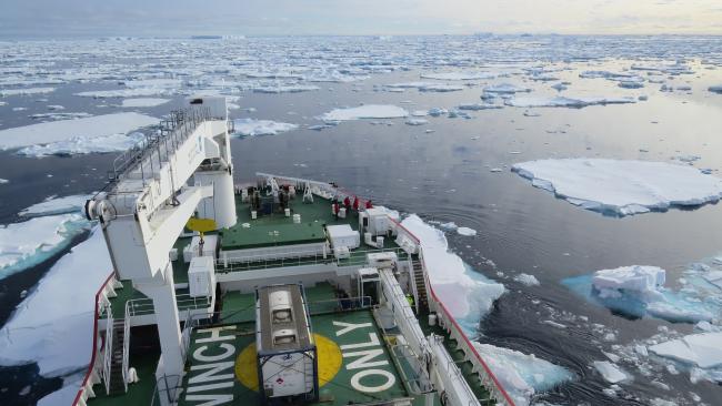 Image of ice sheets on the sea - the view from the top of a research vessel 