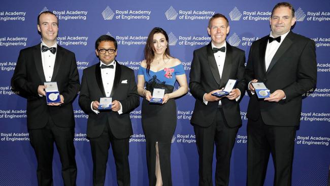 Image of Heba Bevan OBE (pictured centre) with the award