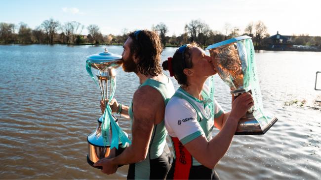 Image of From left, Seb Benzecry and Jenna Armstrong, Jesus students and Cambridge University Boat Club Presidents kiss the Boat Race trophies.Pic credit: Nordin Catic