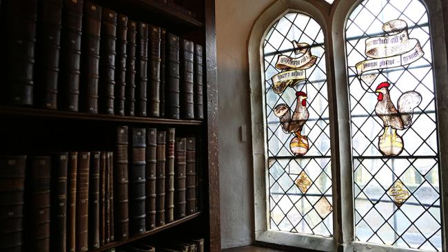 Image of Books and stained glass windows in the Old Library