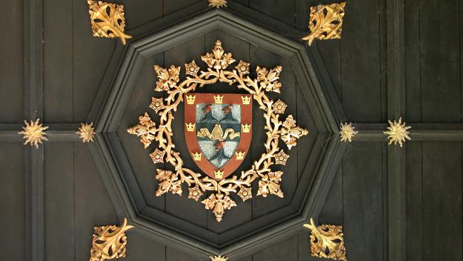 Image of Detail from the Gate tower ceiling showing College crest