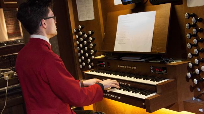 Image of Organist playing the organ