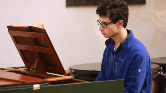 Image of Organ Scholar playing the harpsichord