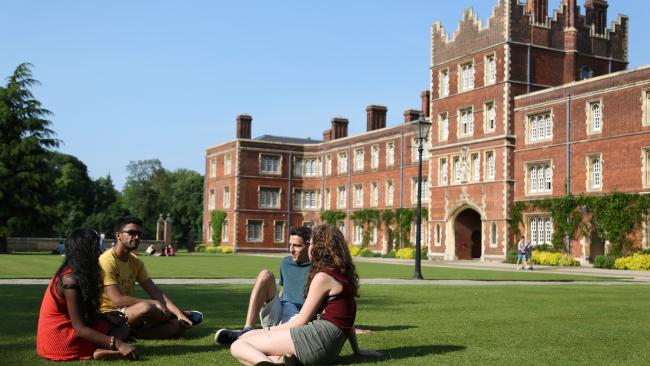 Students sitting on College lawn