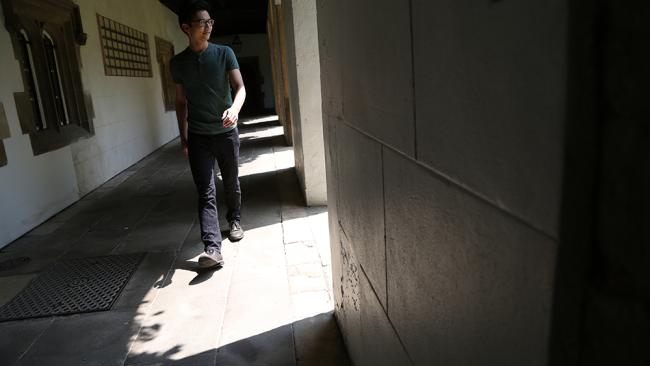 Student walking in Cloister Court
