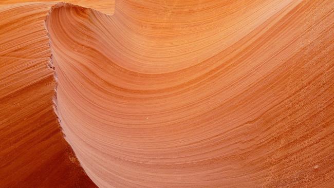 A close up image of sandstone eroded by water