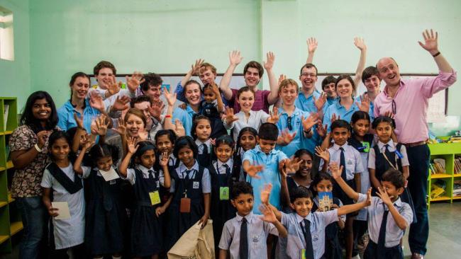 Choir members with school children in India