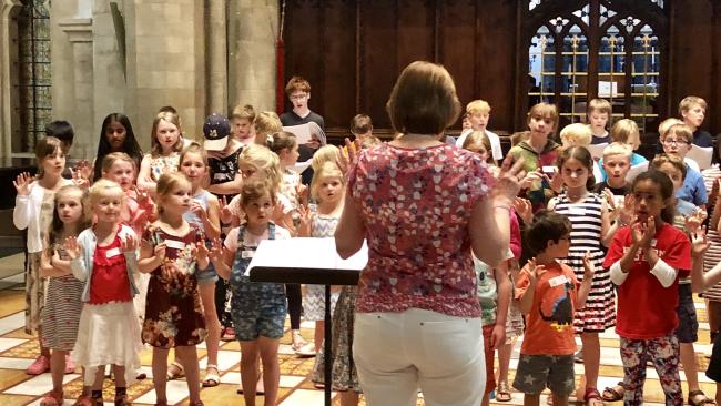 Children listening to an adult in the Jesus College Chapel