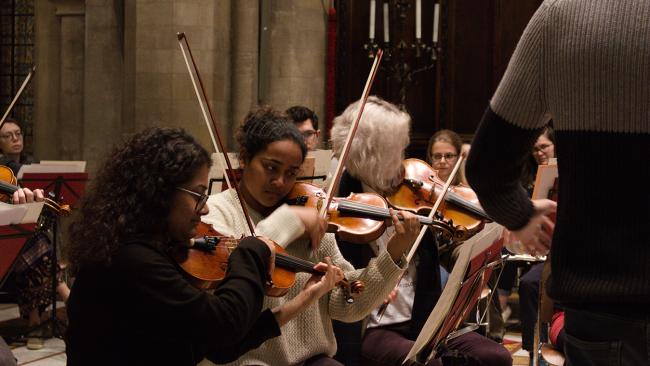 Photos of several students playing instruments at the David Crighton concert