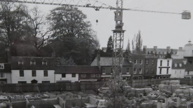 Photograph showing a crane above the building site at Manor Place